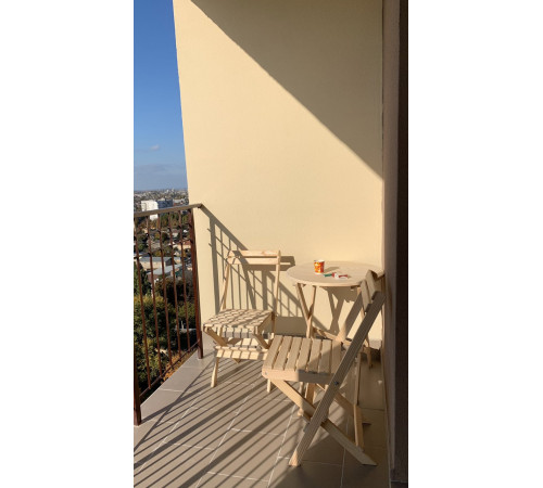 A set of wooden folding furniture (table and 2 chairs)