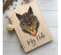 An unusual wooden notebook with an image of a fox.