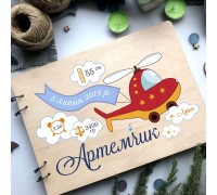 Kinderalbum im Holzeinband.