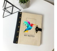Notebook made of leather and wood with the image of a hummingbird