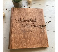 Wooden wedding book with personalized engraving.