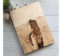 Album in a wooden cover with an engraved portrait.