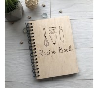 A spring-bound cookbook for writing down recipes.