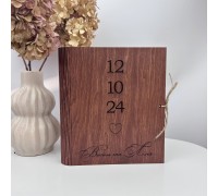 A unique gift for a wedding or 5th anniversary is an album in a wooden cover.