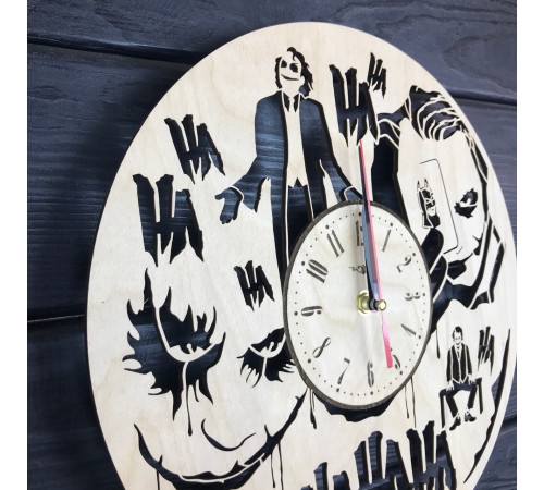 Round wall clock with a designer dial "Joker"