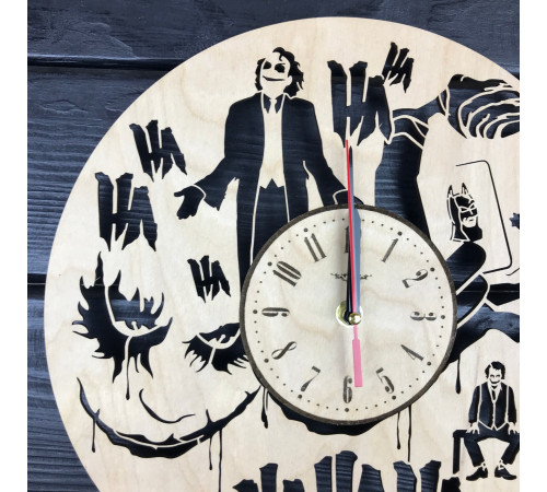 Round wall clock with a designer dial "Joker"