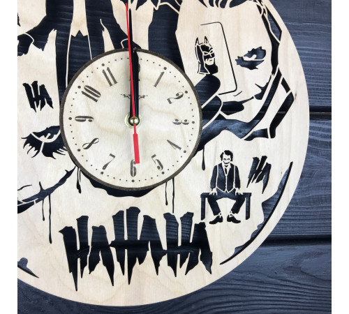 Round wall clock with a designer dial "Joker"