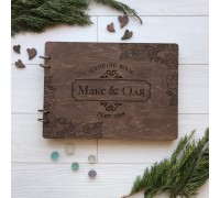 Wooden wedding album with names for photos and wishes.