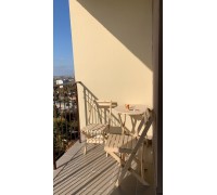 A set of wooden folding furniture (table and 2 chairs)