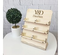 Wooden desktop business card holder with personalized engraving.
