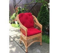 "Ordinary" wicker chair with a red cushion