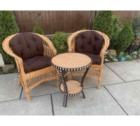 2 low-back chairs + round table "Crab" with rattan and pillows.