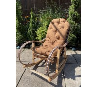 Rocking chair made of wicker and rattan inserts "Rattan" chocolate with white inserts and a pillow.